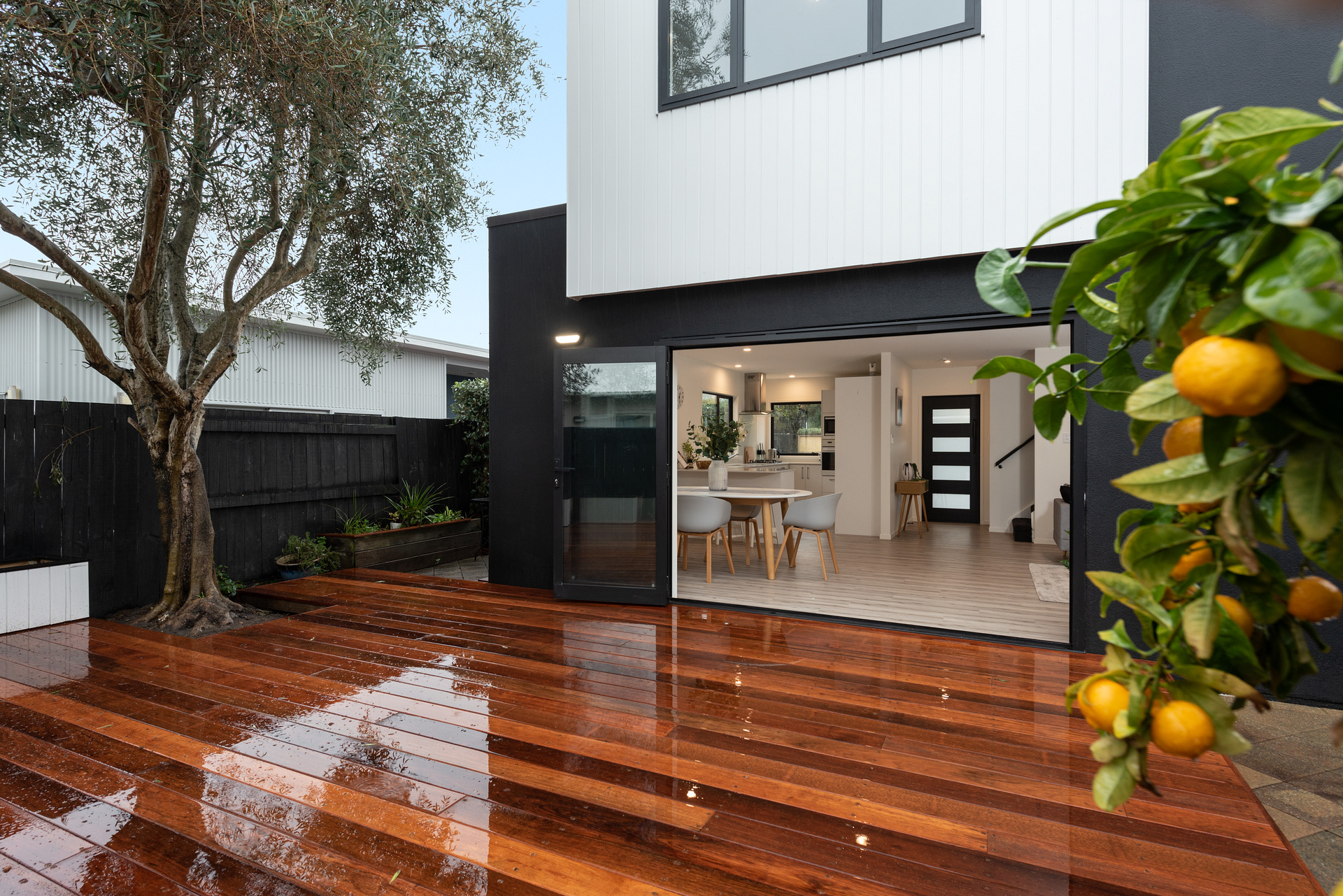 Renovated home opening onto a timber garden deck