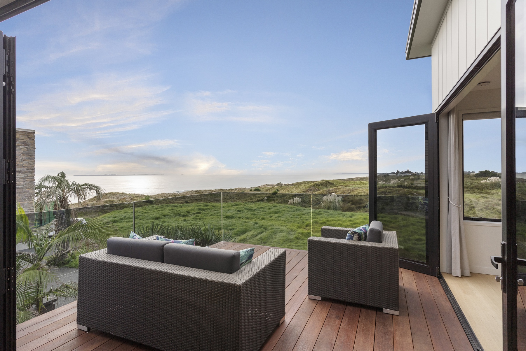 Coastal home with modern cladding and elevated outdoor living spaces